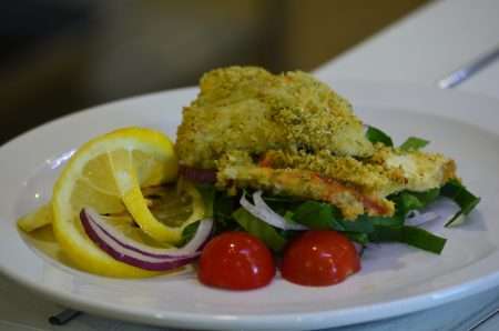 Fish dish with salad on a plate