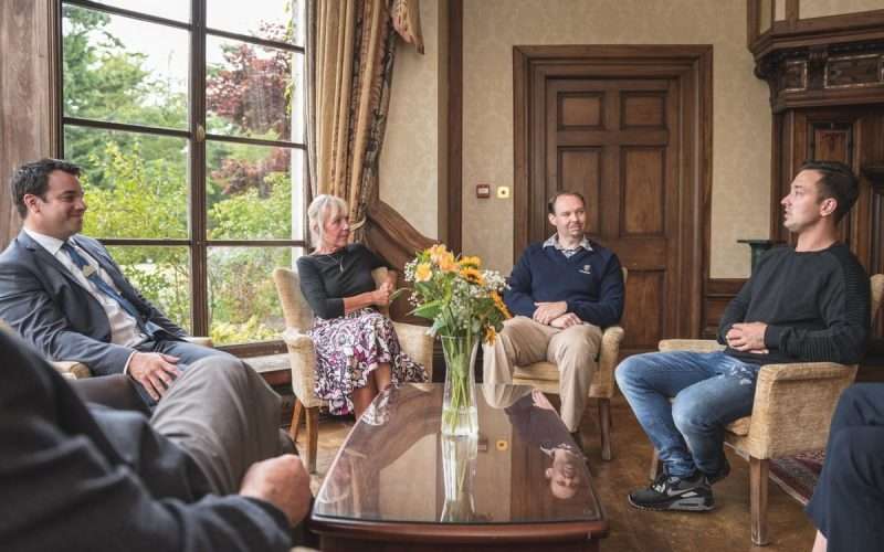 Group therapy session near window with natural light at Castle Craig private residential rehab