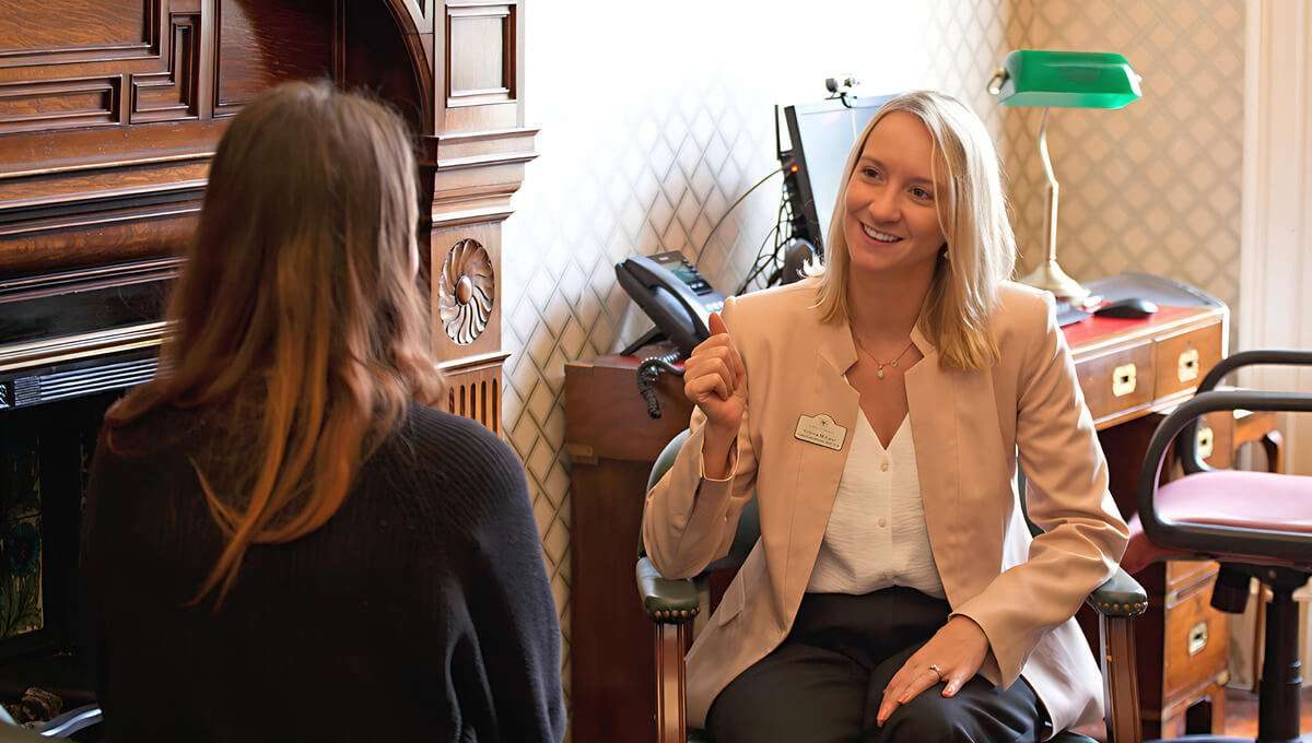 Female therapist smiling with individual therapy patient