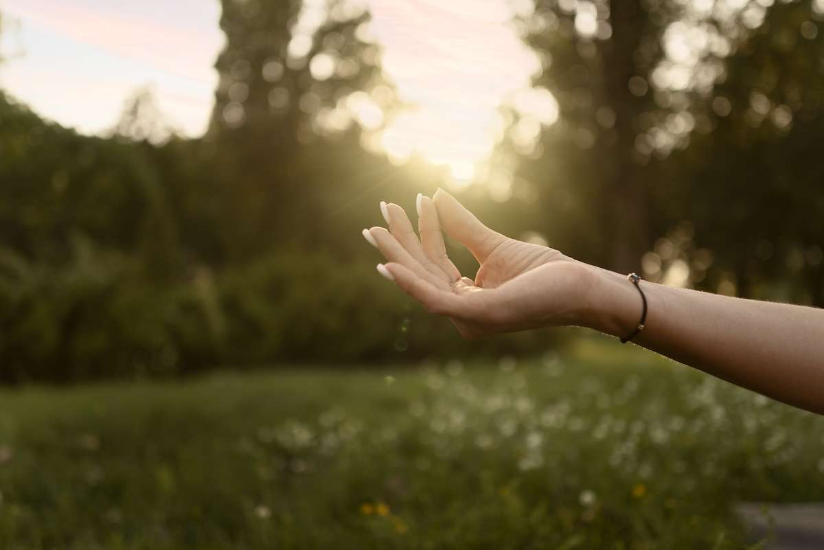 Side view hand spiritual healing nature