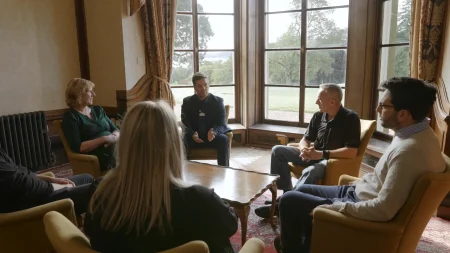 Addiction Counsellor leading a group therapy session.